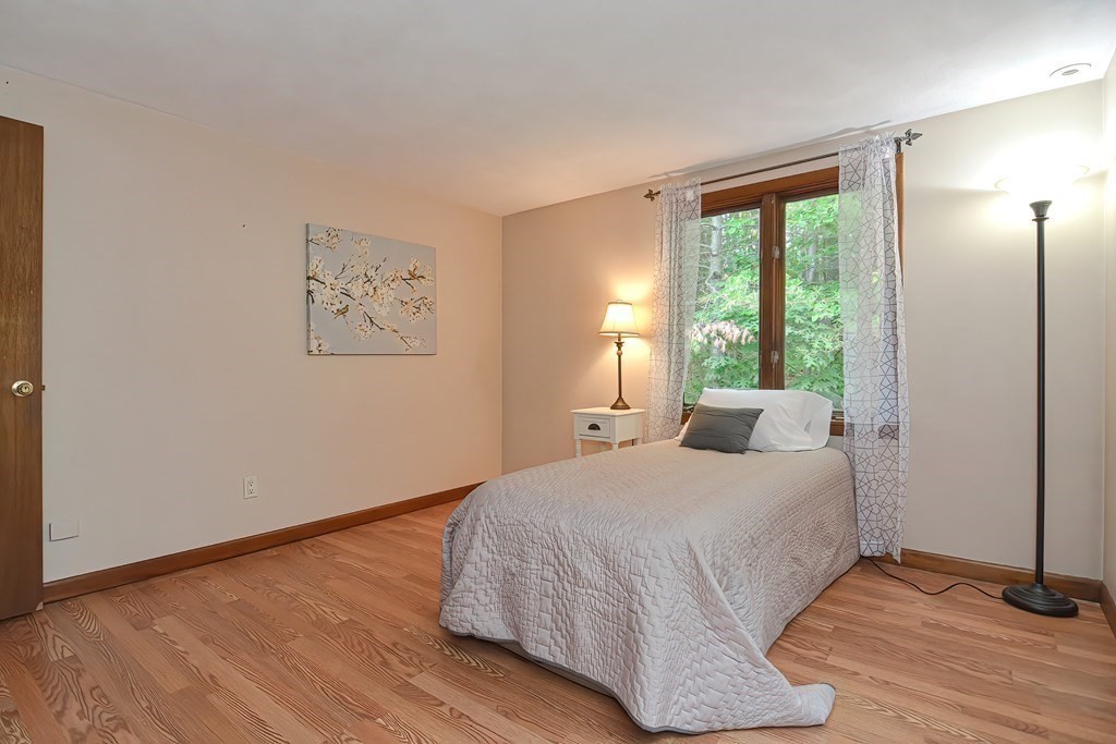202 Boxboro Road Stow, MA 01775 - Photo 28 of 40 a bedroom with a large bed and a window