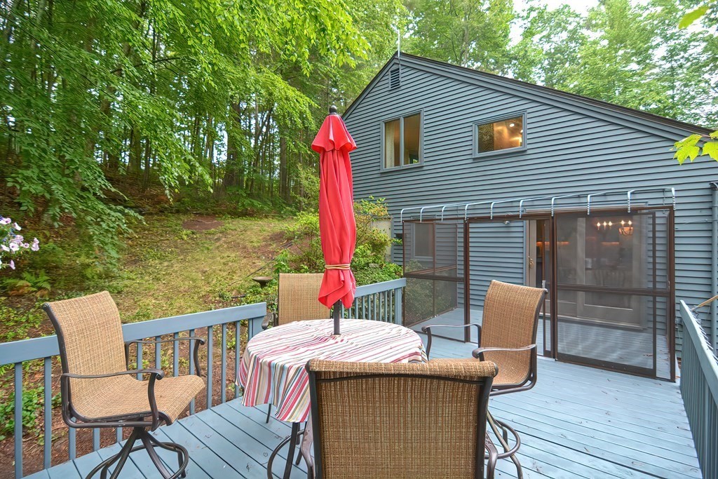 202 Boxboro Road Stow, MA 01775 - Photo 3 of 40 a view of deck with a table and chairs