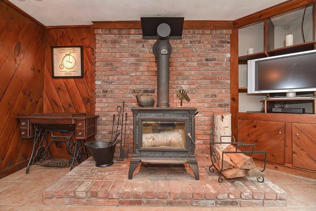 202 Boxboro Road Stow, MA 01775 - Photo 32 of 40 a living room with furniture and a fireplace