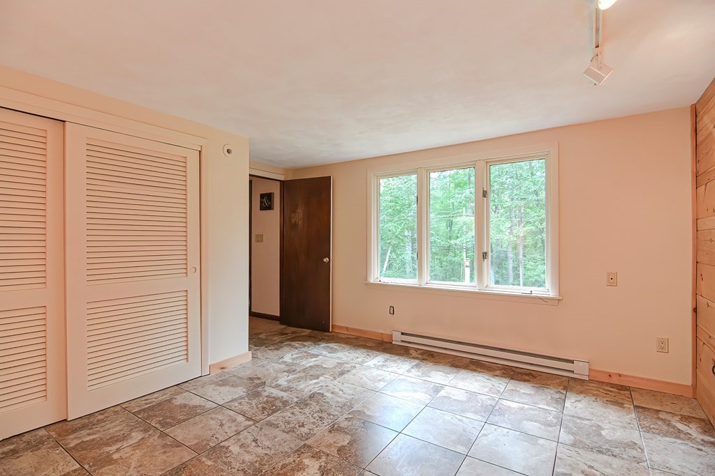 202 Boxboro Road Stow, MA 01775 - Photo 34 of 40 an empty room with windows