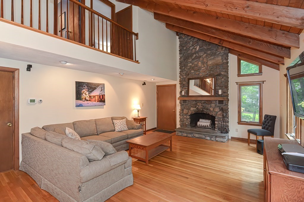 202 Boxboro Road Stow, MA 01775 - Photo 4 of 40 a living room with furniture and a fireplace