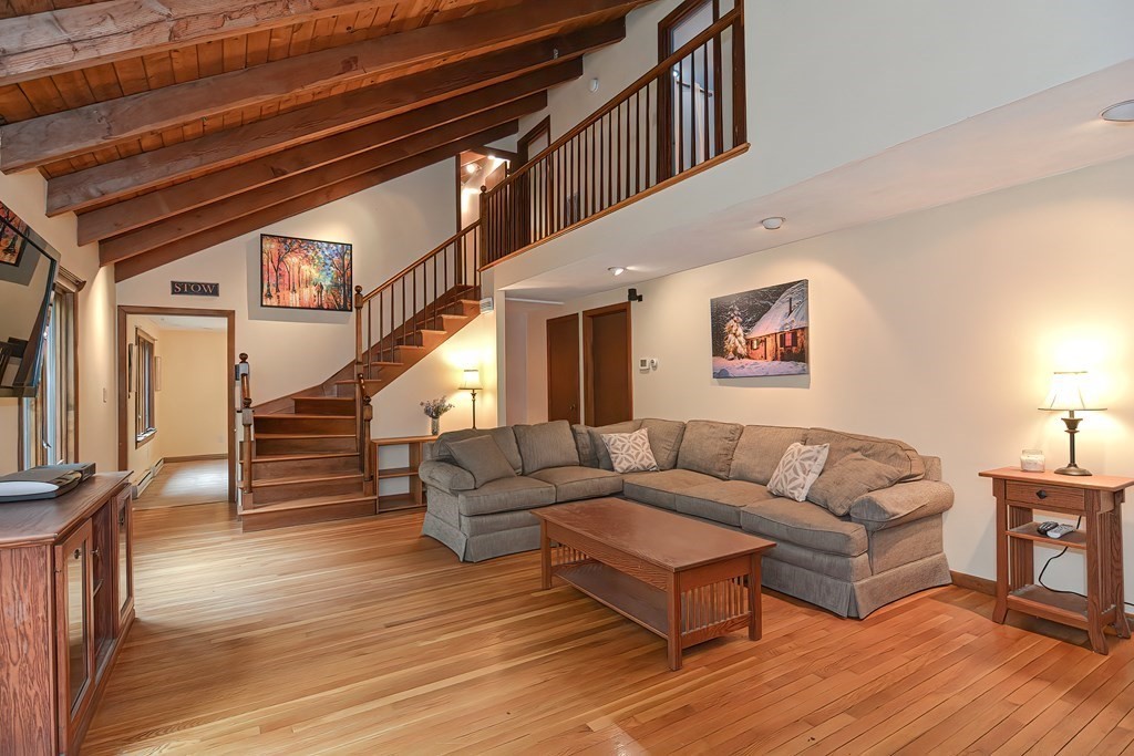 202 Boxboro Road Stow, MA 01775 - Photo 5 of 40 a living room with furniture and wooden floors