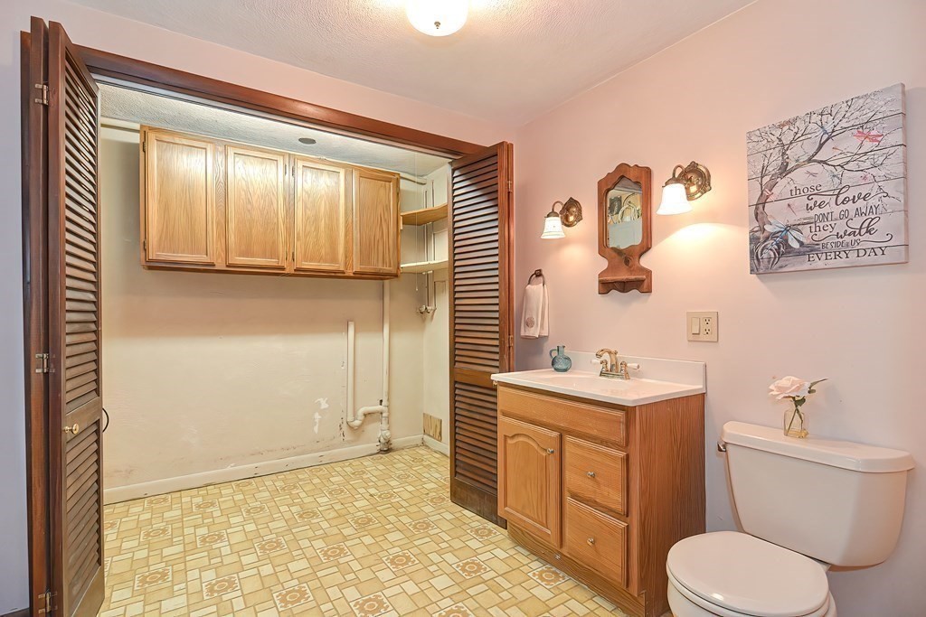 202 Boxboro Road Stow, MA 01775 - Photo 10 of 40 a bathroom with a toilet sink and mirror