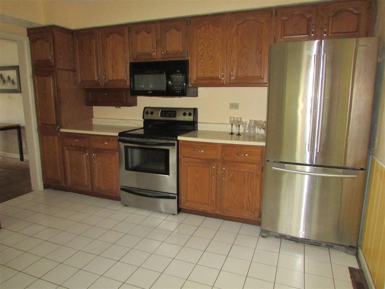 6280 Park Ridge Road Loves Park, IL 61111 - Photo 11 of 25 a kitchen with stainless steel appliances a refrigerator stove and microwave