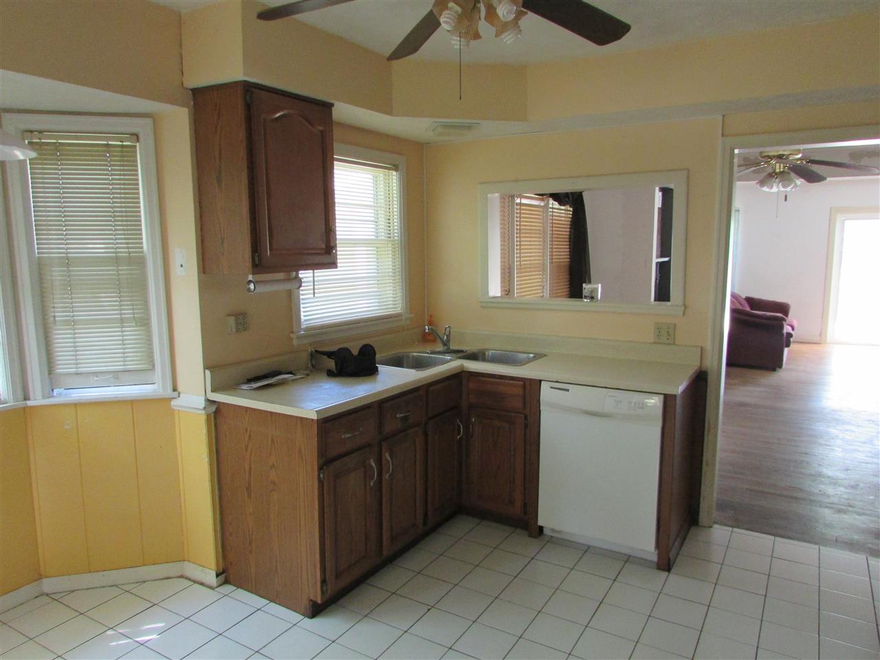 6280 Park Ridge Road Loves Park, IL 61111 - Photo 12 of 25 a kitchen with a stove and a sink