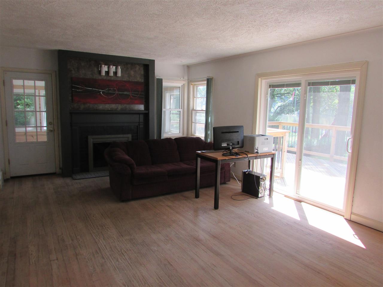 6280 Park Ridge Road Loves Park, IL 61111 - Photo 19 of 25 a living room with furniture and a fireplace