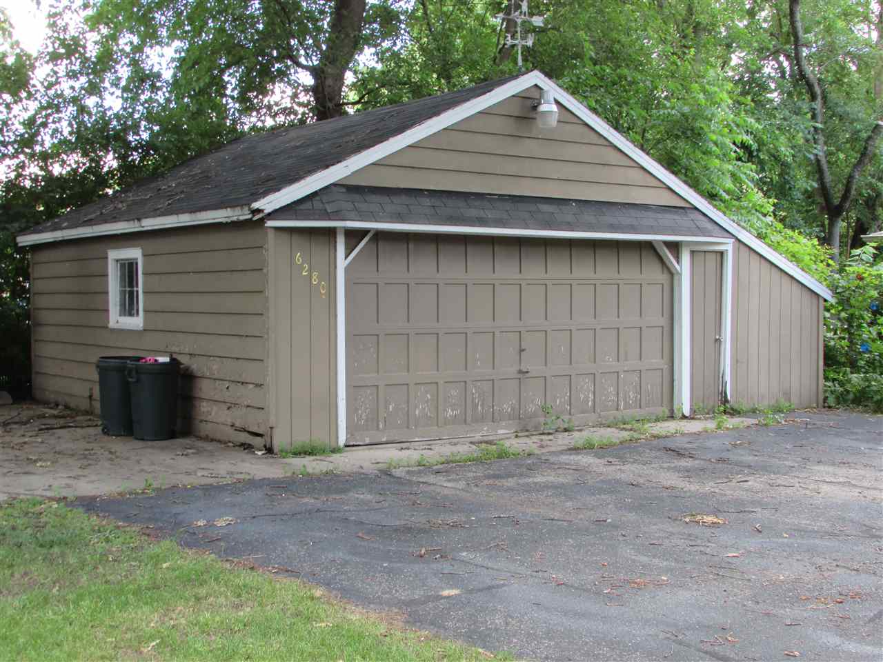 6280 Park Ridge Road Loves Park, IL 61111 - Photo 25 of 25 a small wooden house with a small yard and large trees