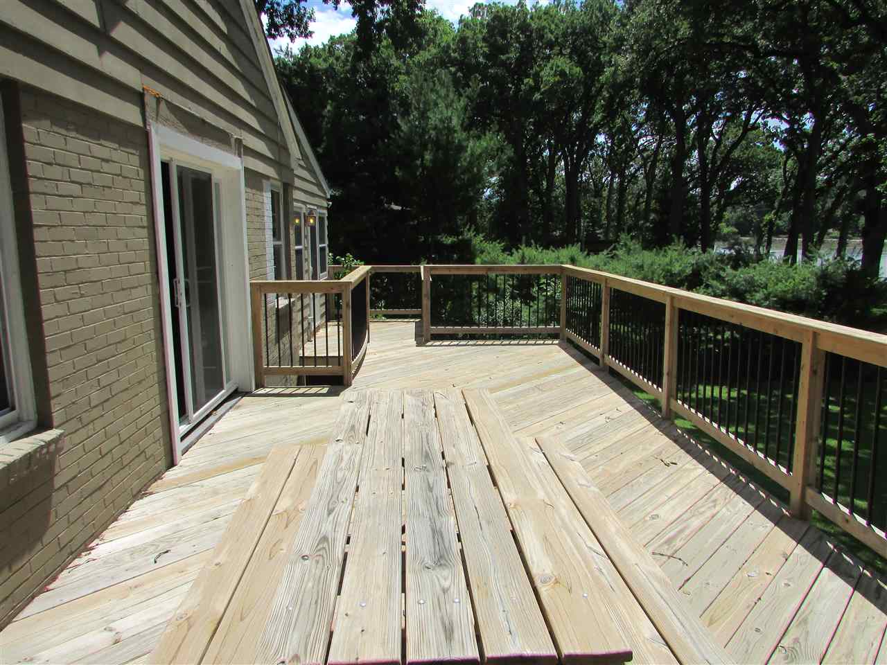6280 Park Ridge Road Loves Park, IL 61111 - Photo 4 of 25 a view of balcony with wooden floor and fence