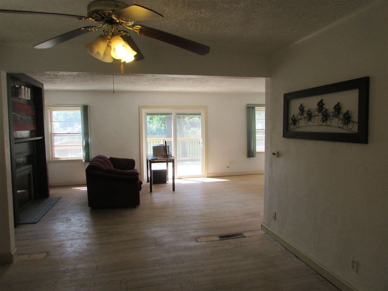 6280 Park Ridge Road Loves Park, IL 61111 - Photo 9 of 25 a living room with furniture and a chandelier
