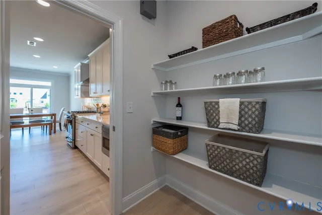 a kitchen with stainless steel appliances granite countertop a lot of counter space and wooden floor