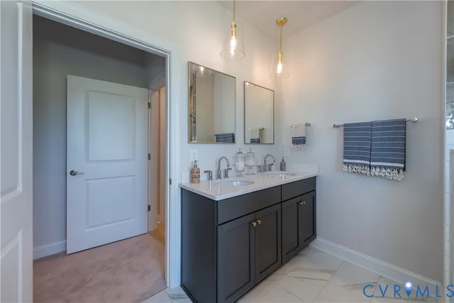 a bathroom with a sink a vanity and a mirror