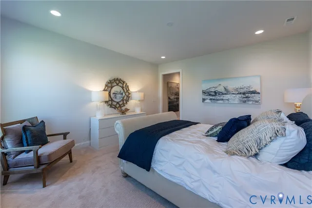 a bedroom with a bed and a couch