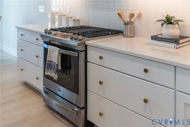 a bathroom with a granite countertop sink a large mirror and vanity
