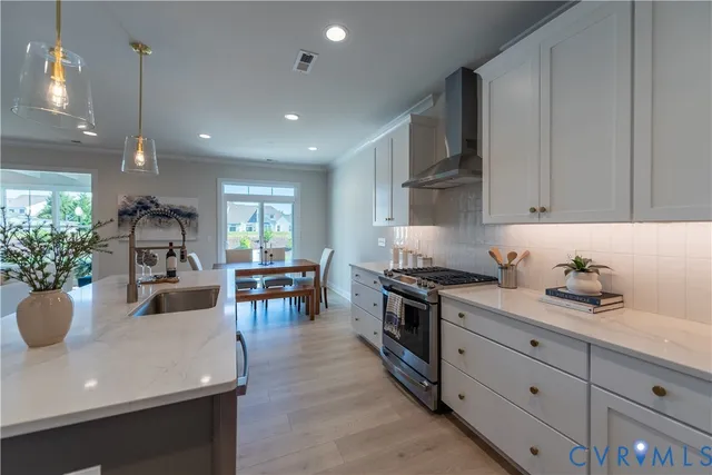 a kitchen with a stove and cabinets
