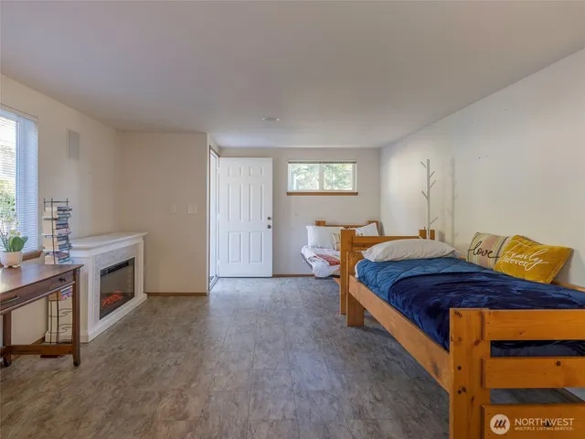 a workspace with a fireplace and a window