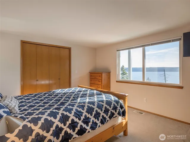 a bathroom with a sink vanity mirror and a bathtub