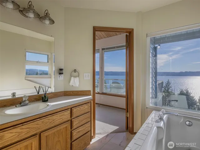 a view of a balcony with wooden fence