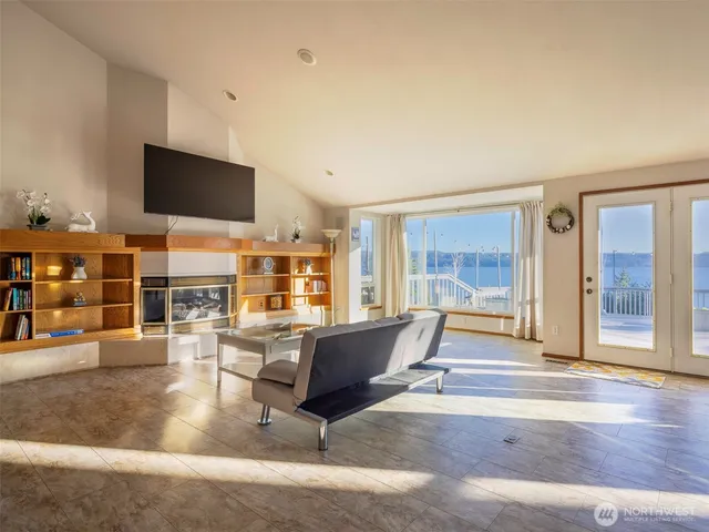 a living room with furniture and flat screen tv