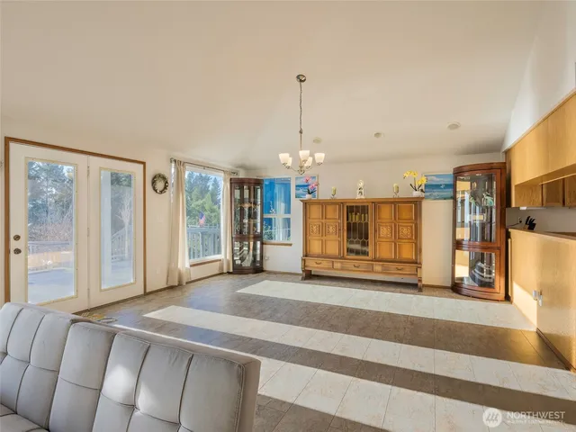 a living room with a couch and a table with wooden floor