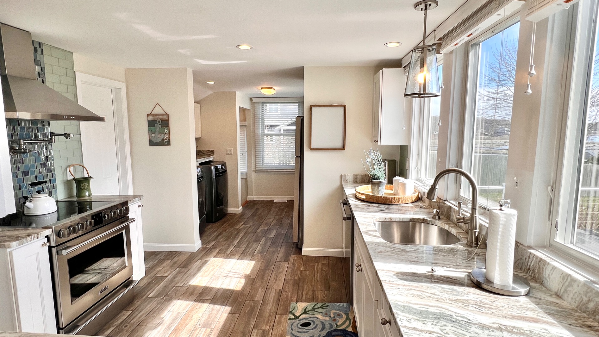 34 Windemere Road Oak Bluffs, MA 02557 - Photo 12 of 64 a kitchen with stainless steel appliances granite countertop a stove top oven a sink and a refrigerator