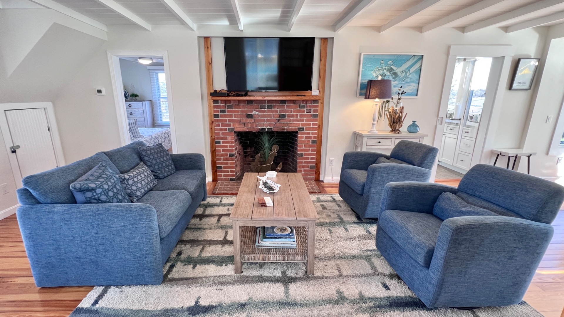 34 Windemere Road Oak Bluffs, MA 02557 - Photo 16 of 64 a living room with furniture and a fireplace