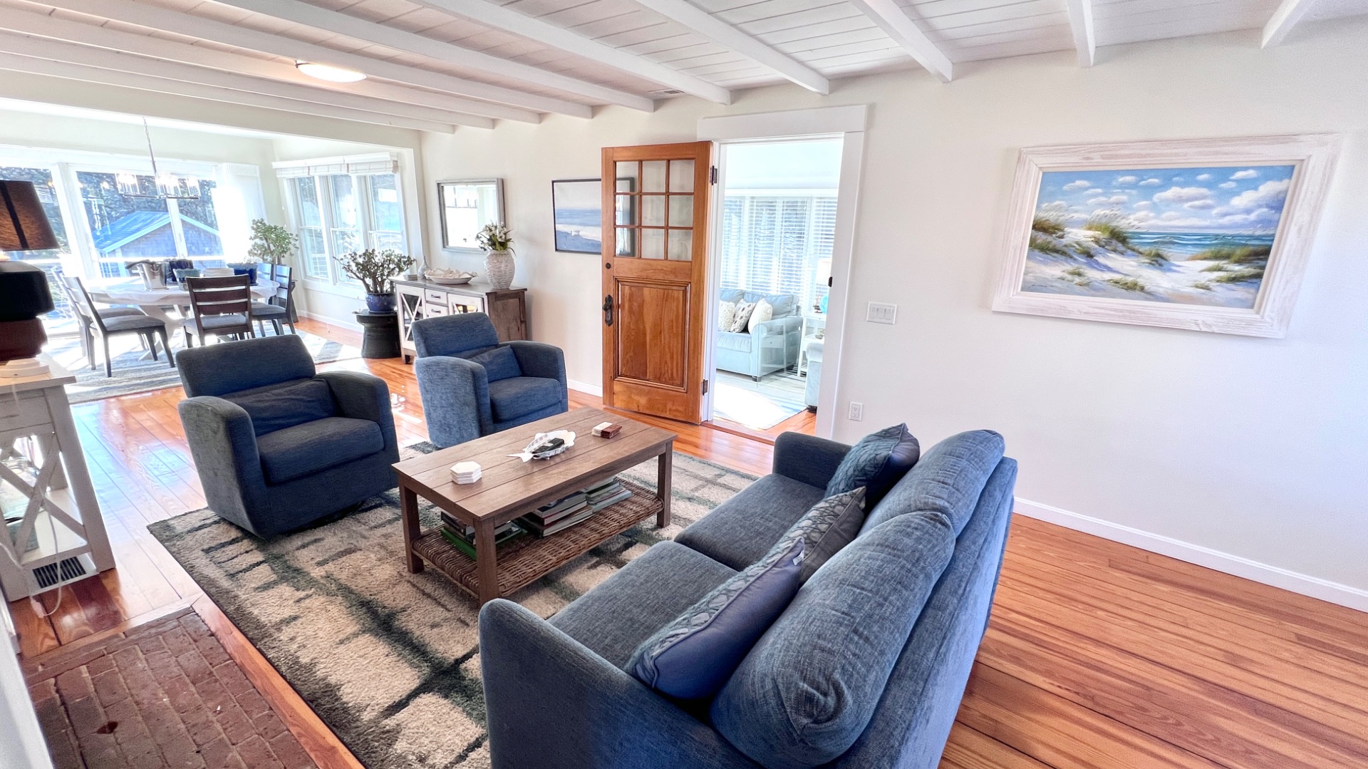 34 Windemere Road Oak Bluffs, MA 02557 - Photo 17 of 64 a living room with furniture a couch and a bookshelf