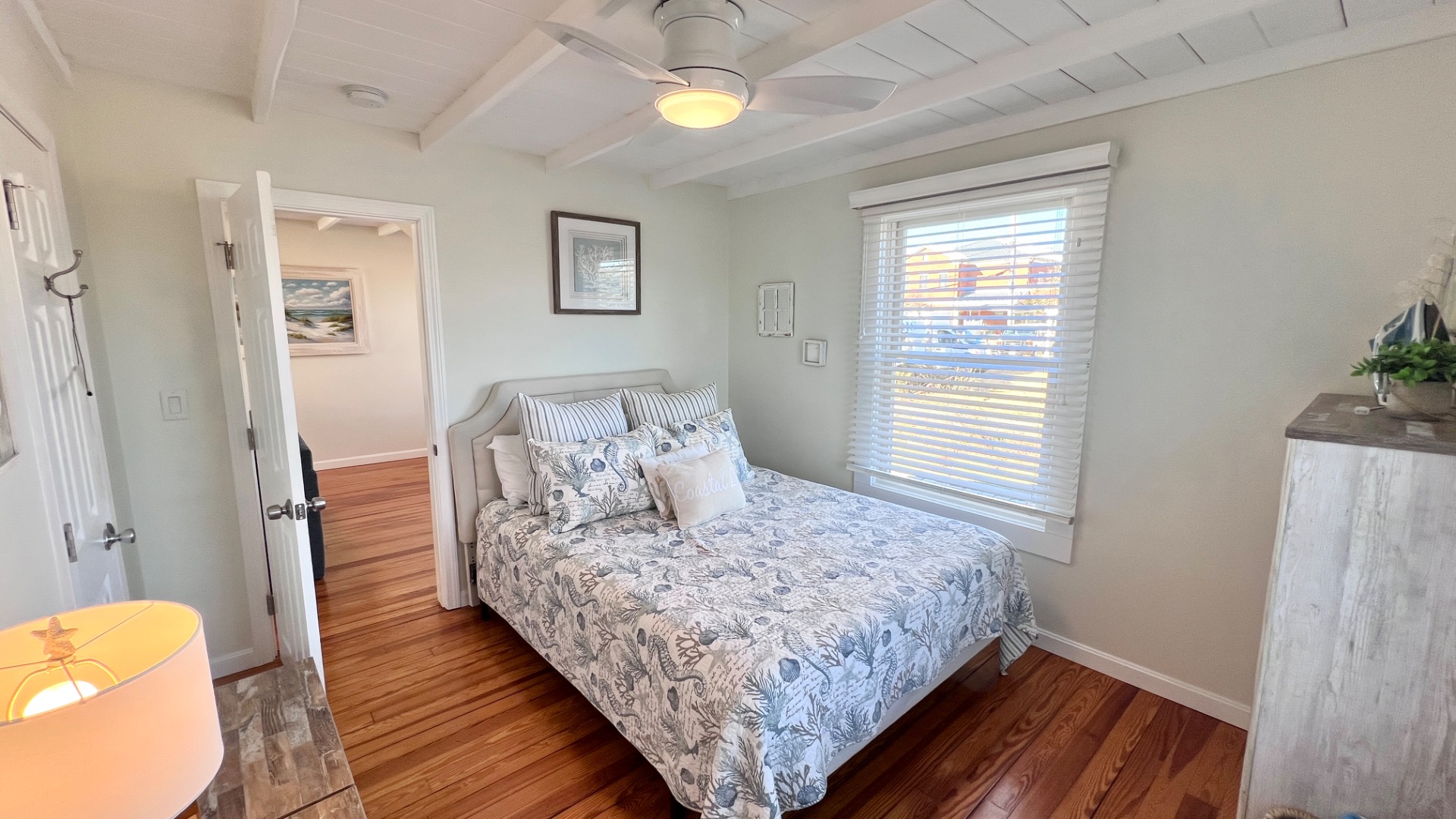 34 Windemere Road Oak Bluffs, MA 02557 - Photo 31 of 64 a bedroom with a bed and wooden floor