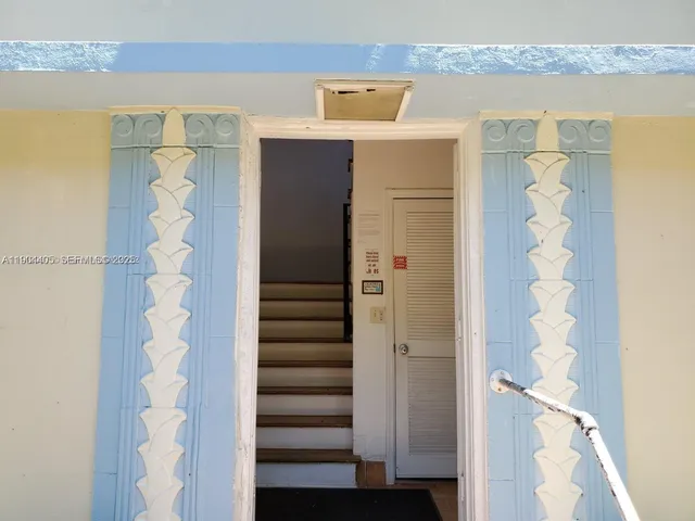 a view of a hallway with windows