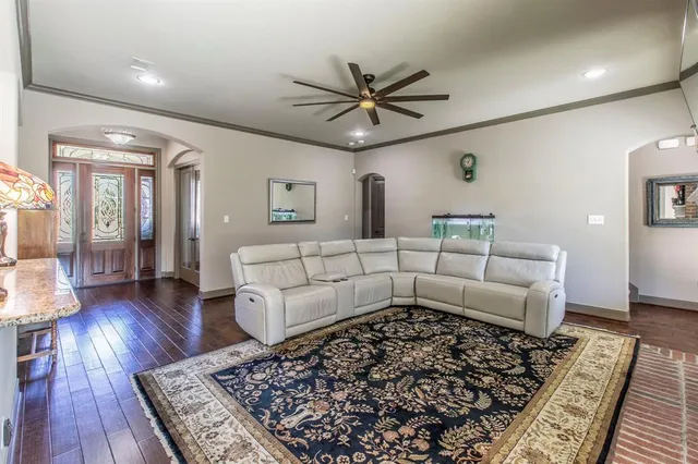 a bedroom with furniture and wooden floor