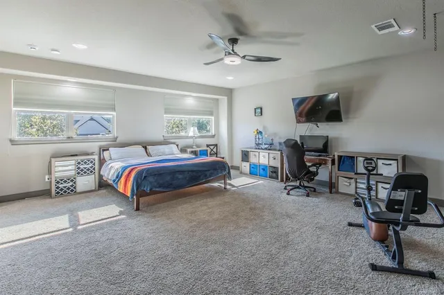 a bedroom with furniture and a window