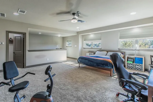 a bed room with a bed and a desk