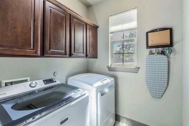 a view of an empty room with windows