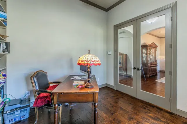 a dining room with furniture and wooden floor