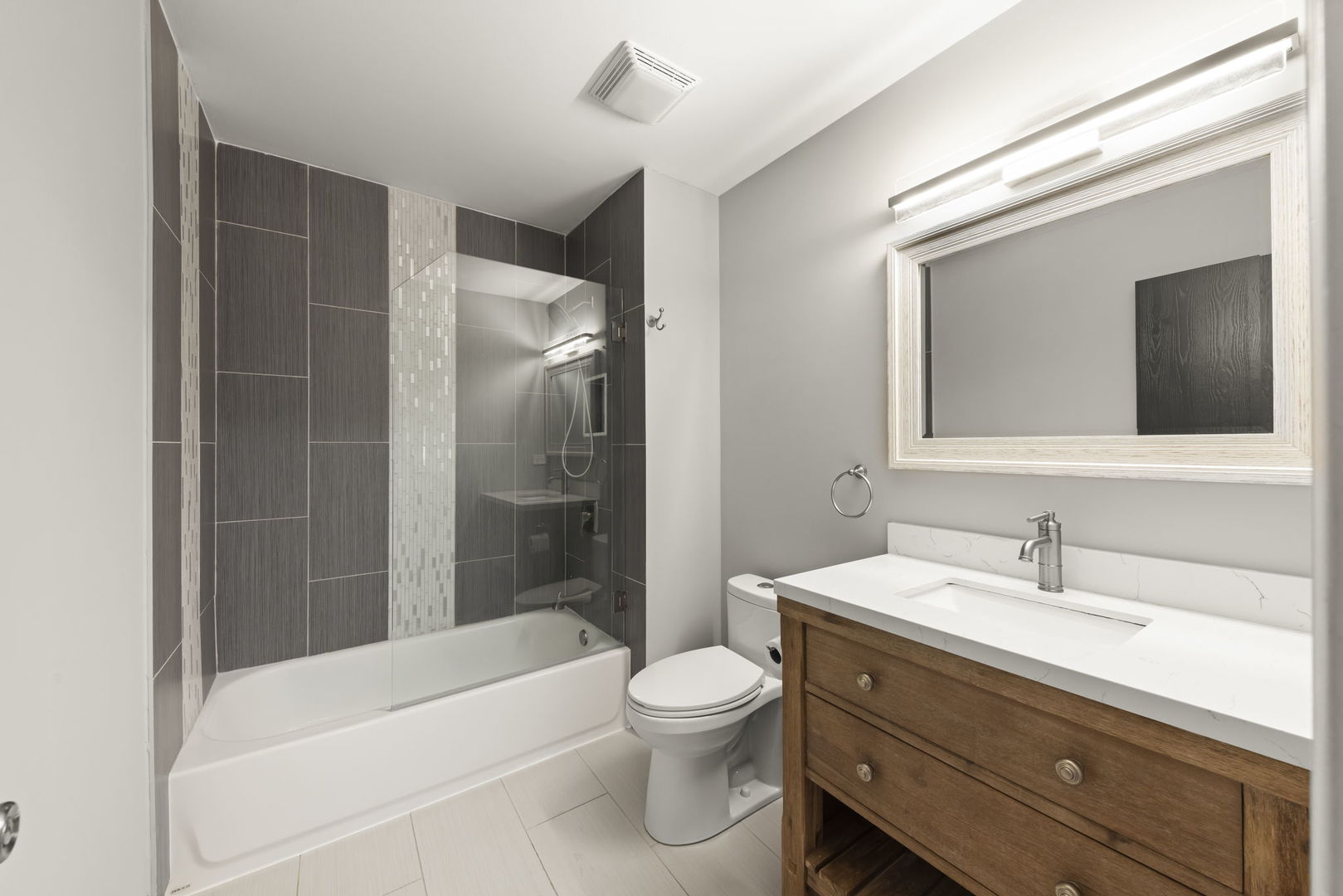 1344 South Lorraine Road, Unit E Wheaton, IL 60189 - Photo 19 of 26 a bathroom with a toilet a sink and bathtub