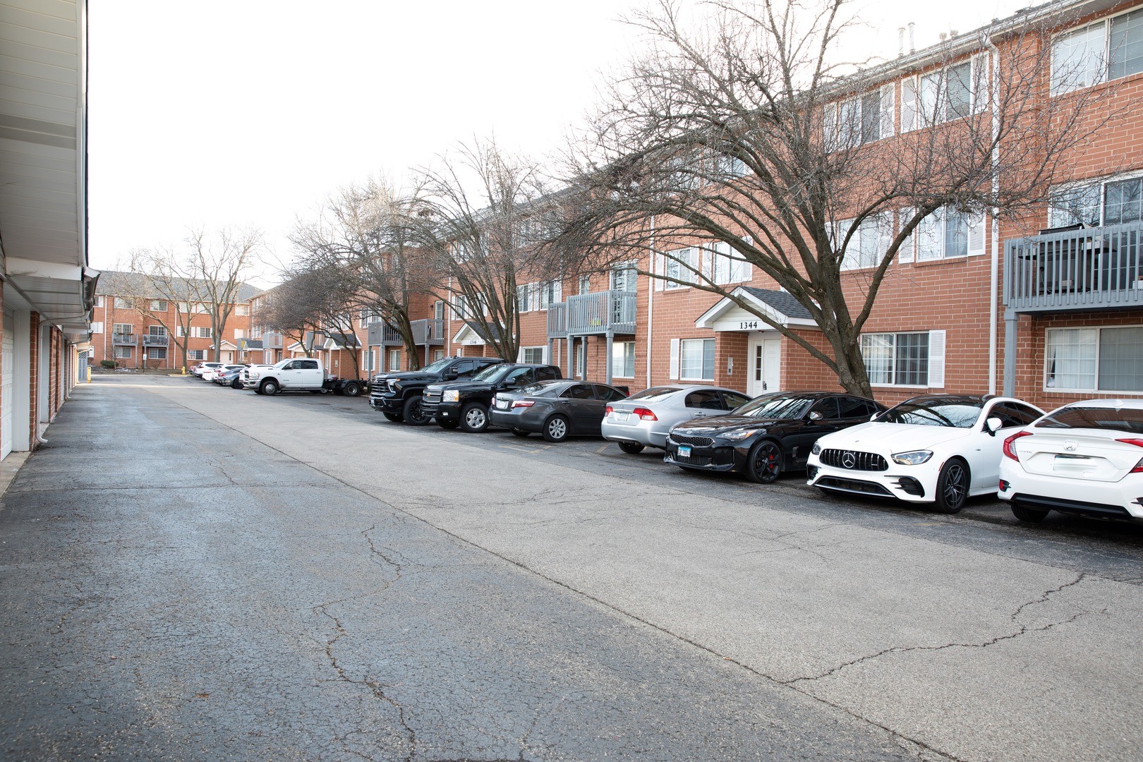 1344 South Lorraine Road, Unit E Wheaton, IL 60189 - Photo 23 of 26 a view of street with parked cars