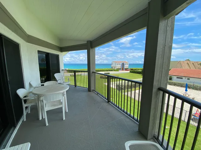 a view of a porch with furniture and outside view