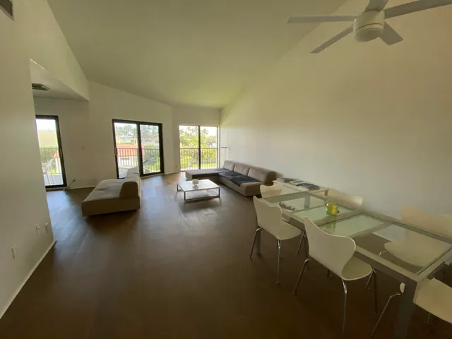 a view of a workspace with furniture and a couch