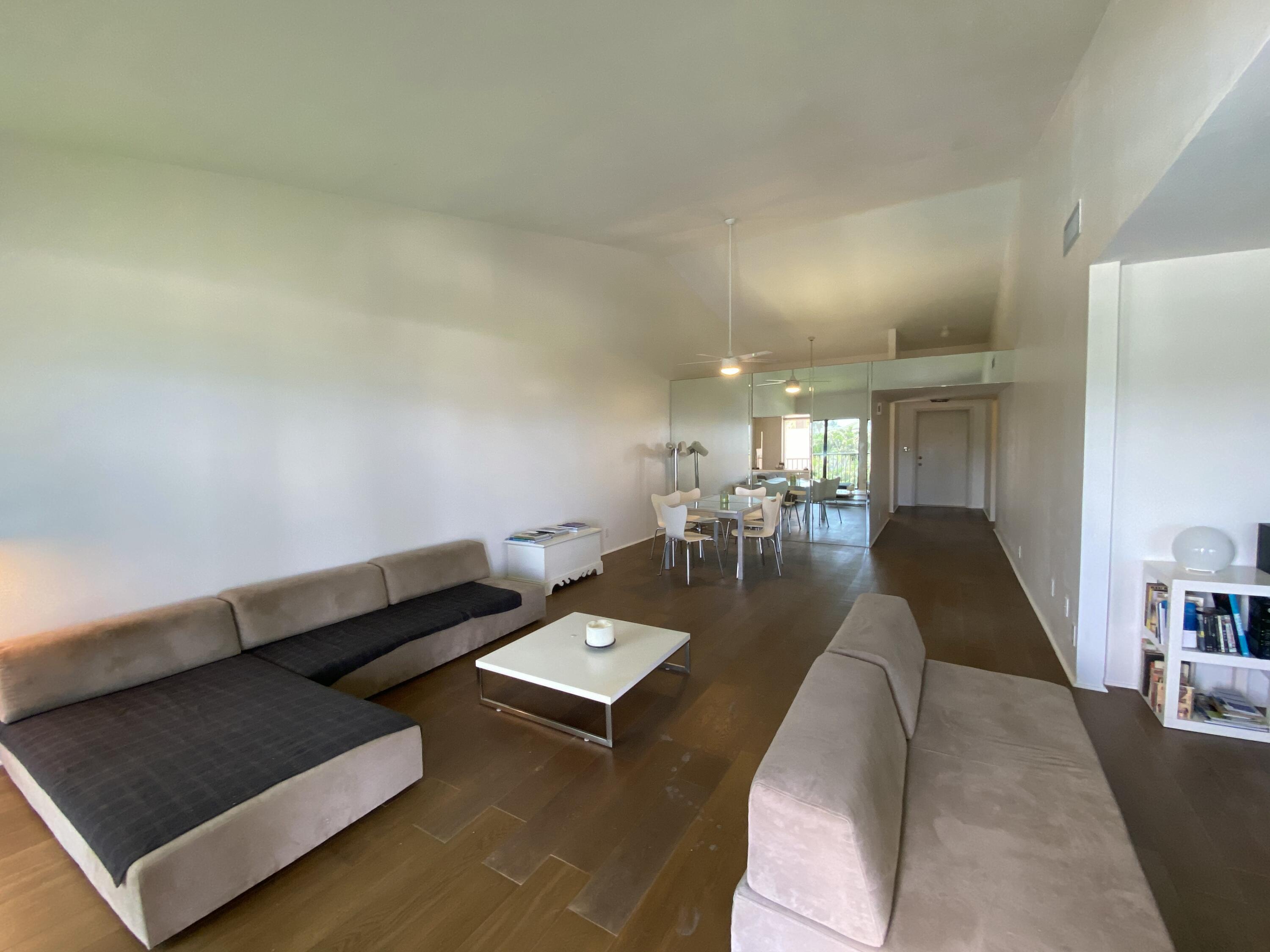 5801 North Ocean Boulevard, Unit 208 Ocean Ridge, FL 33435 - Photo 4 of 7 a living room with furniture and a couch