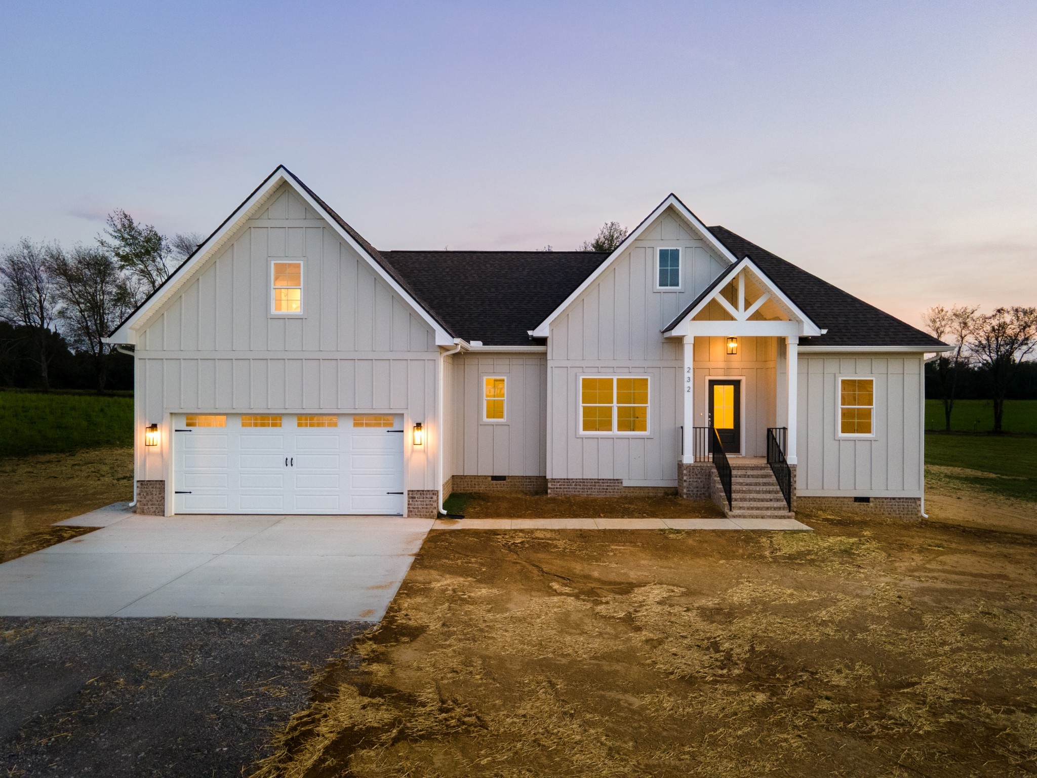 232 Dugout Road Summertown, TN 38483 - Photo 12 of 64 a front view of a house with a yard
