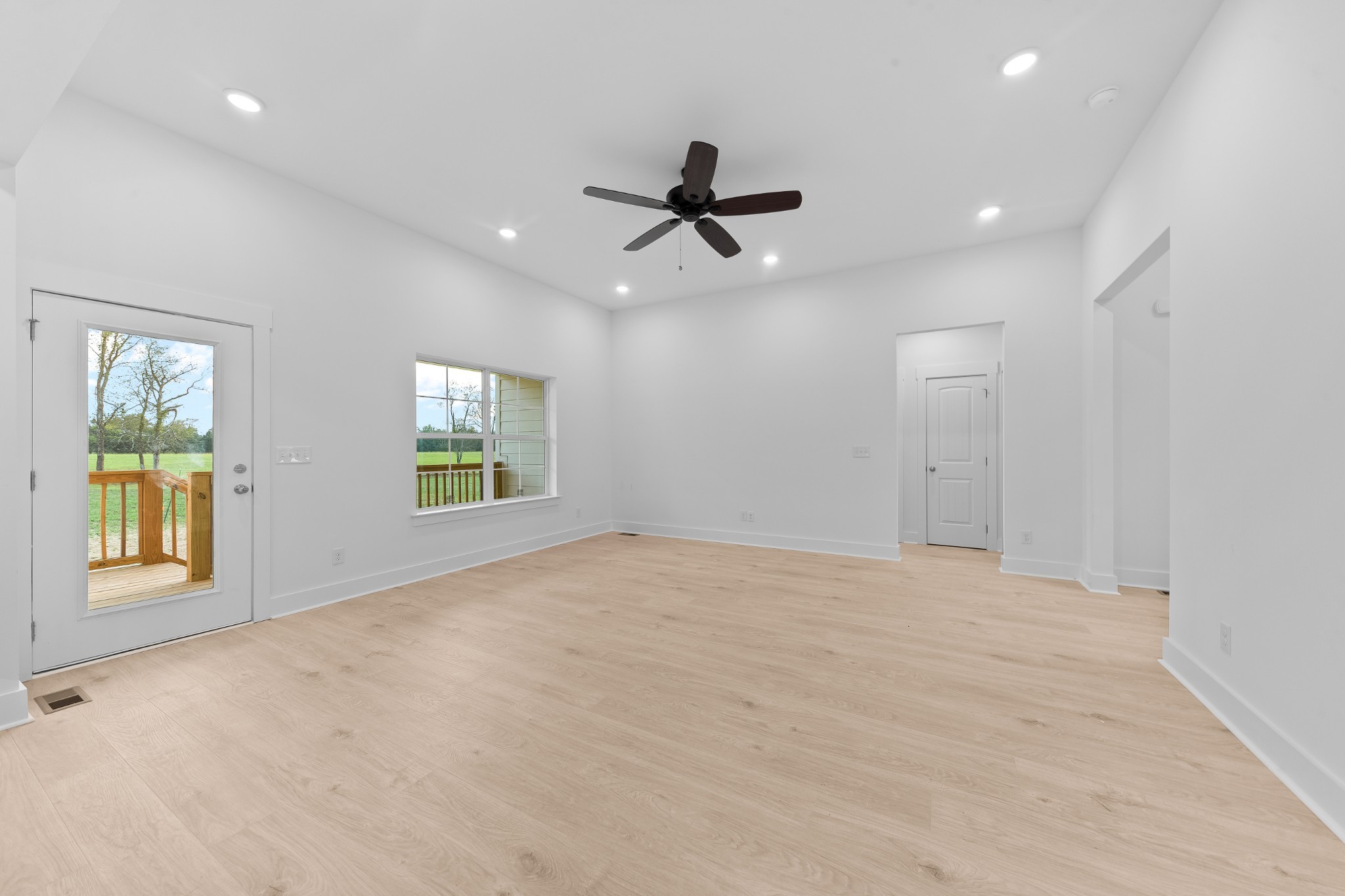 232 Dugout Road Summertown, TN 38483 - Photo 29 of 64 an empty room with windows and ceiling fan