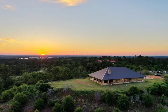 a view of a town with mountains in the background
