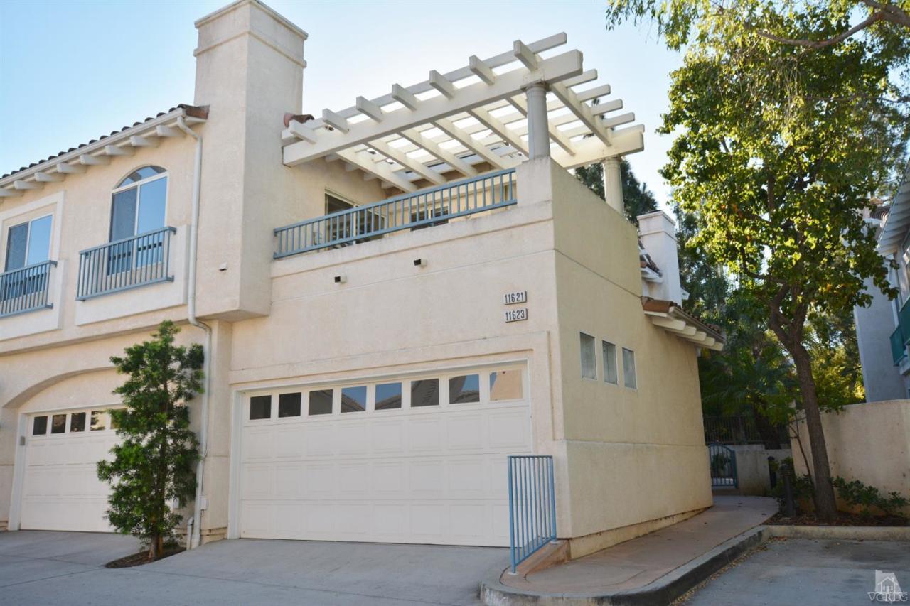 11621 Countrysprings Court, Unit 16 Moorpark, CA 93021 - Photo 1 of 14 a large white building with a white roof