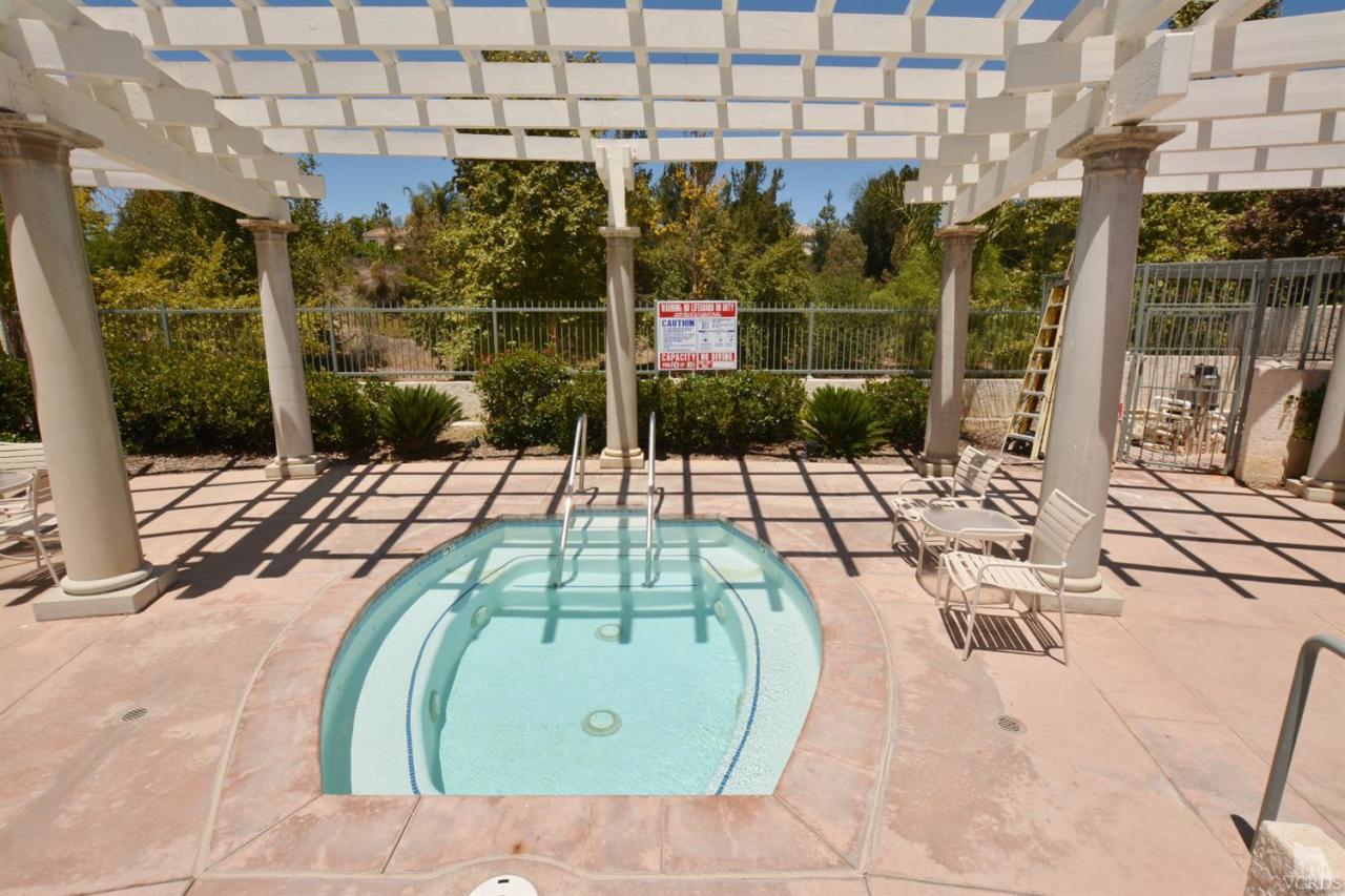 11621 Countrysprings Court, Unit 16 Moorpark, CA 93021 - Photo 12 of 14 a view of a swimming pool with a patio