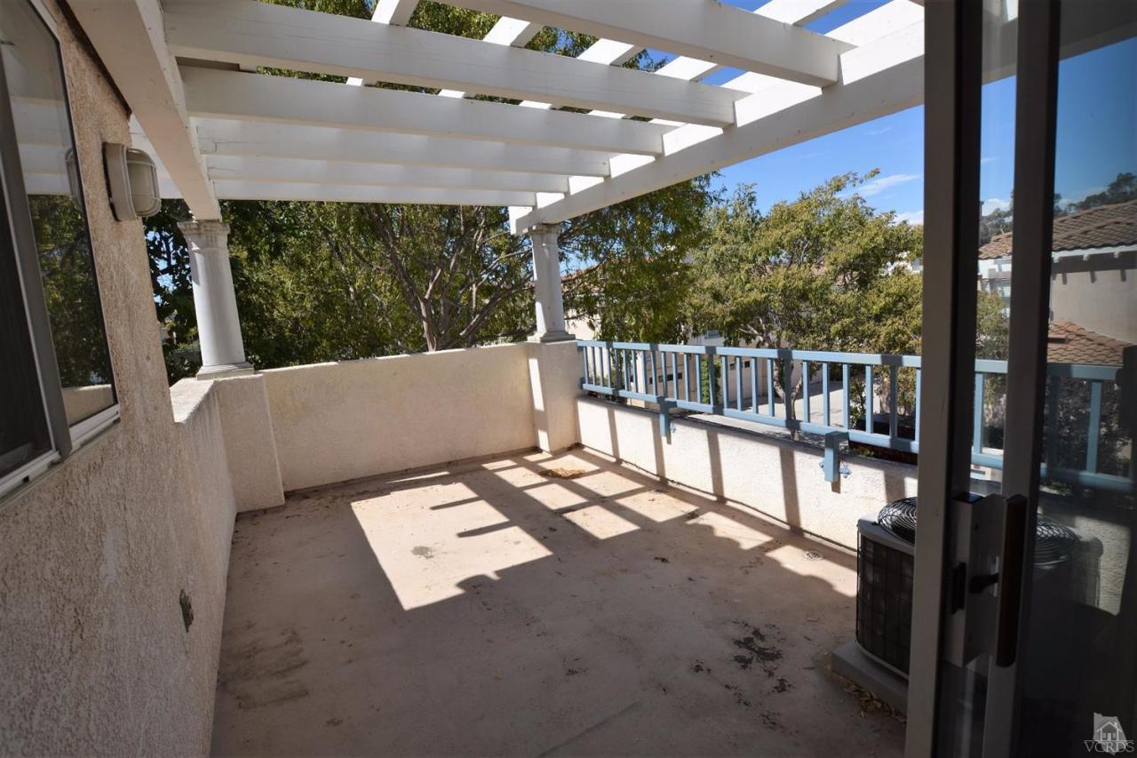 11621 Countrysprings Court, Unit 16 Moorpark, CA 93021 - Photo 8 of 14 a view of balcony with couch
