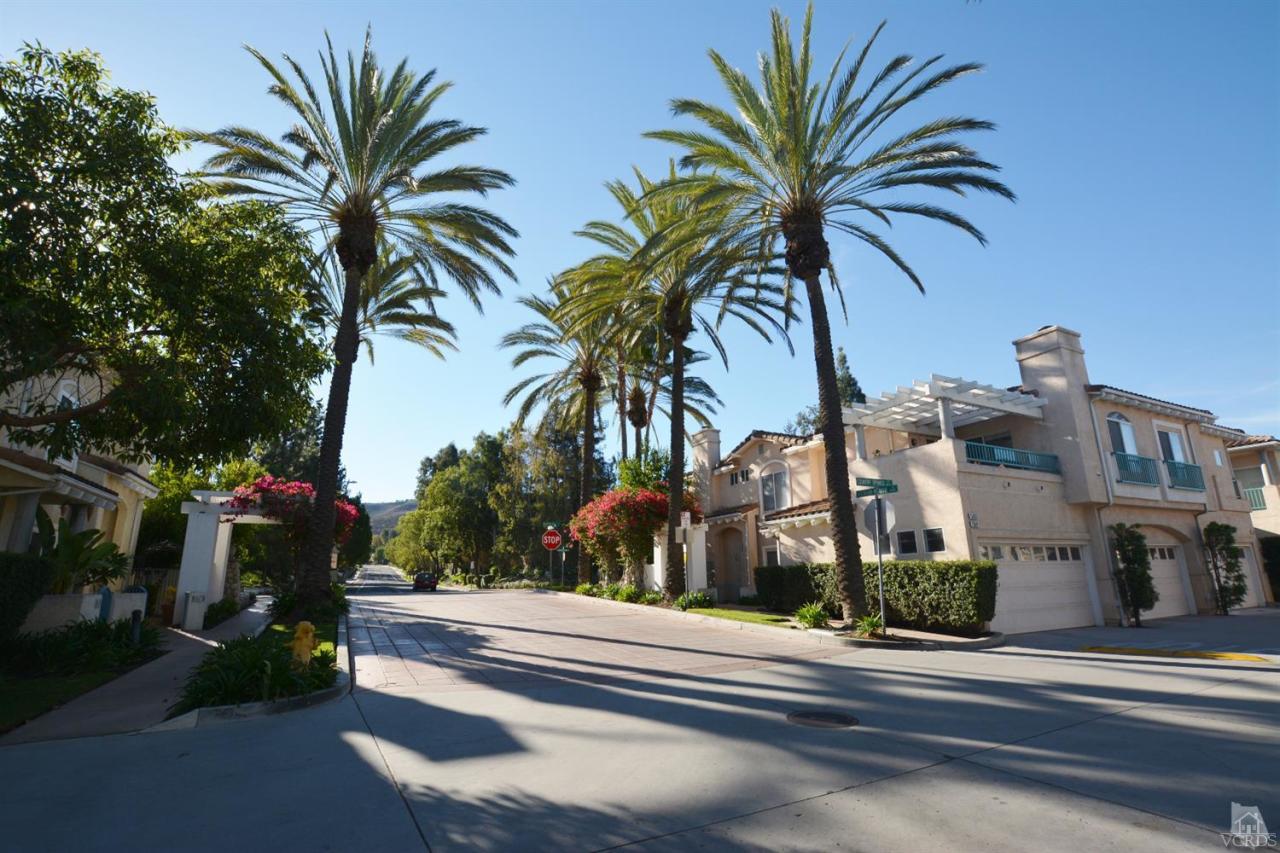 11621 Countrysprings Court, Unit 16 Moorpark, CA 93021 - Photo 9 of 14 a view of a building with a palm tree