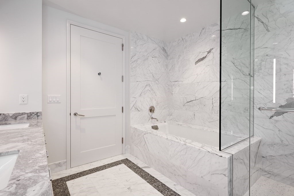 240 Devonshire Street, Unit 4210 Boston, MA 02110 - Photo 7 of 39 a bathroom with a bathtub and a shower
