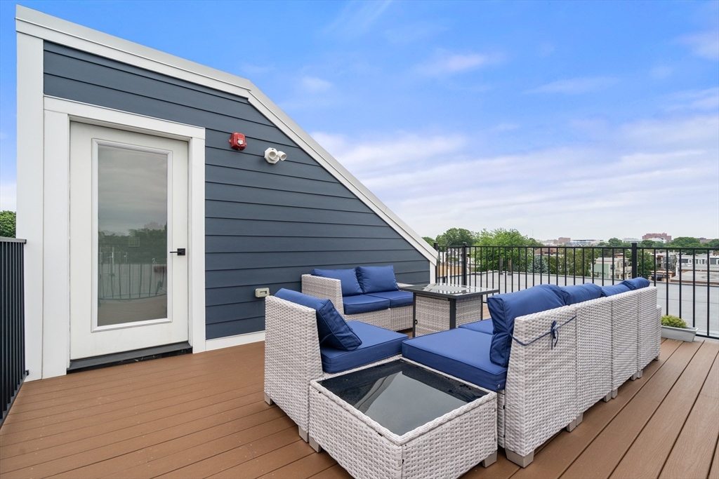 32 Pearl Street, Unit 4 Boston, MA 02125 - Photo 3 of 35 a view of roof deck with furniture