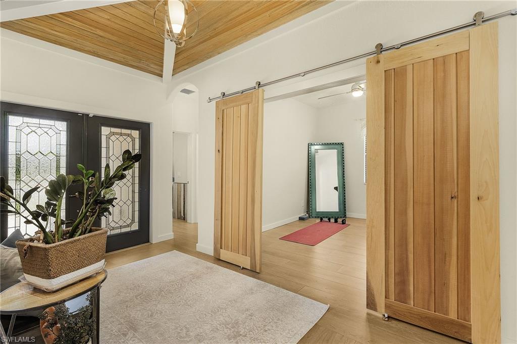 4278 Raffia Preserve Way Naples, FL 34119 - Photo 23 of 36 Den with Barn Doors.