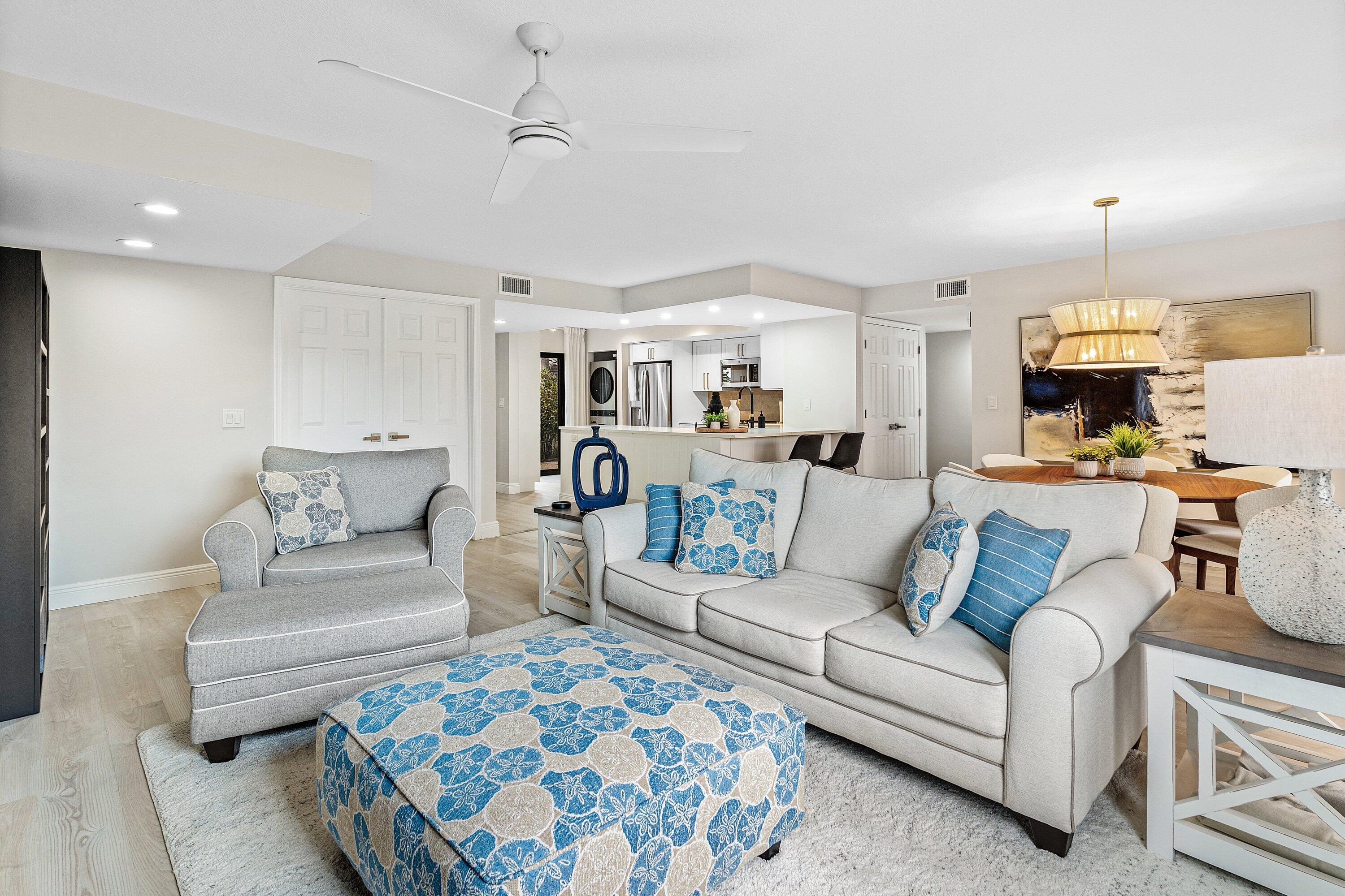 7918 Granada Place, Unit 103 Boca Raton, FL 33433 - Photo 12 of 31 a living room with furniture and a fireplace