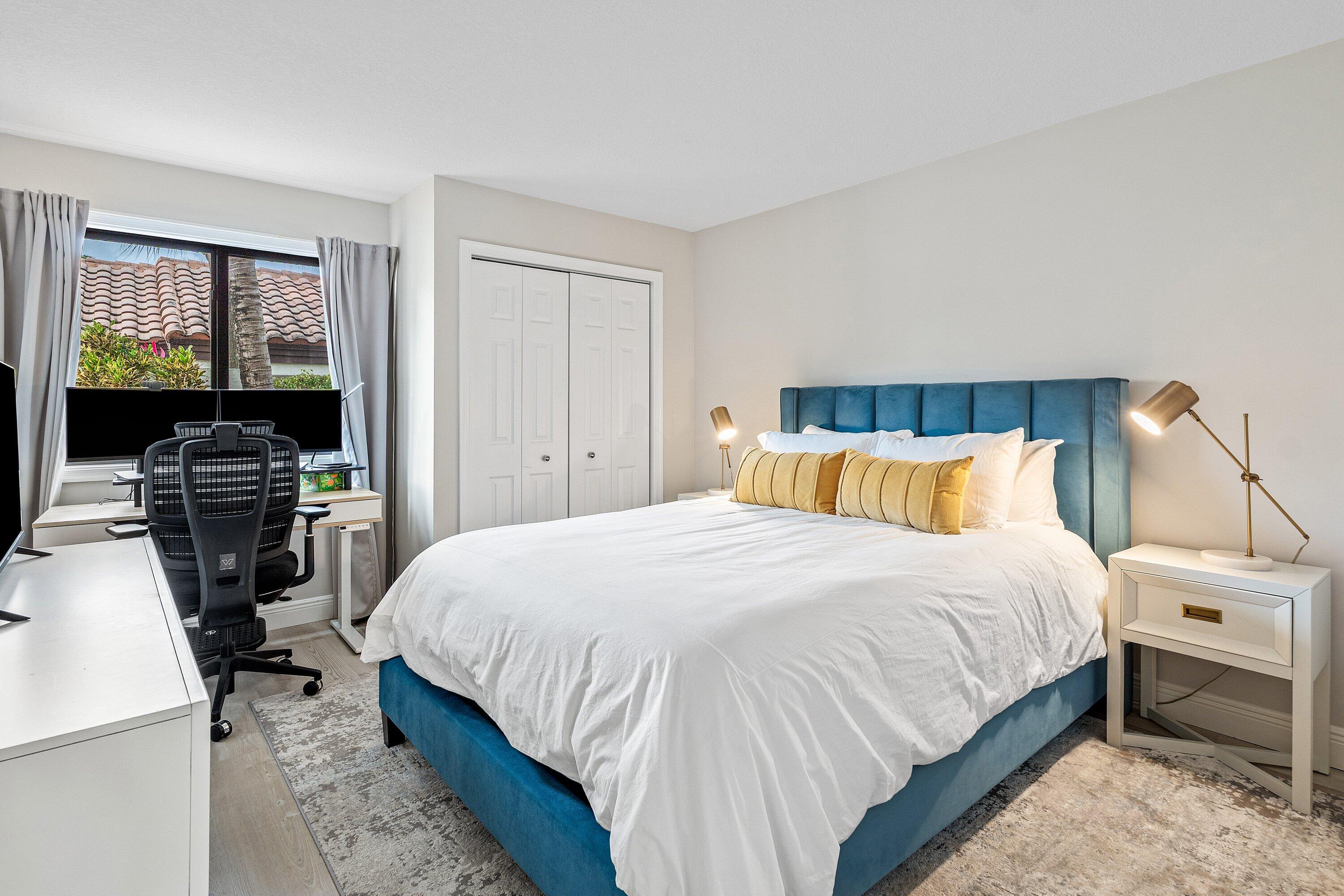 7918 Granada Place, Unit 103 Boca Raton, FL 33433 - Photo 17 of 31 a bedroom with a bed and a view of bathroom